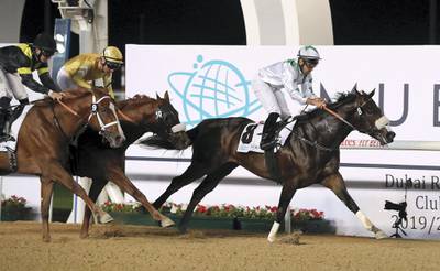 DUBAI , UNITED ARAB EMIRATES , Dec 19  – 2019 :- Fernando Jara ( no 8) guides Dubai Avenue (IRE)  to win the 3rd horse race Strata trophy 1600m dirt at the Meydan Racecourse in Dubai. ( Pawan Singh / The National ) For Sports. Story by Amith
