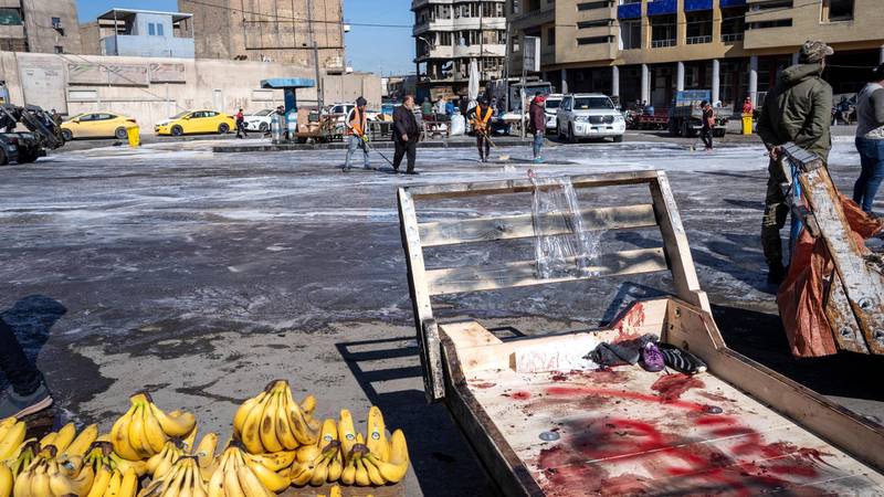 Clean up operations begin at the site of a suicide attack in a central market in Baghdad. Haider Husseini/ The National