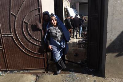 An Afghan woman whose son was killed in a suicide bomb attack on a Shiite religious centre in Kabul reacts as she visits the scene of the bombing.  Hedayatullah Amid / EPA