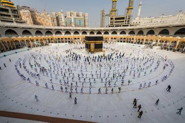 Pilgrims observe social distancing while circumambulating the Kaaba at the Grand Mosque in Makkah, Saudi Arabia. Saudi Ministry of Media via AP