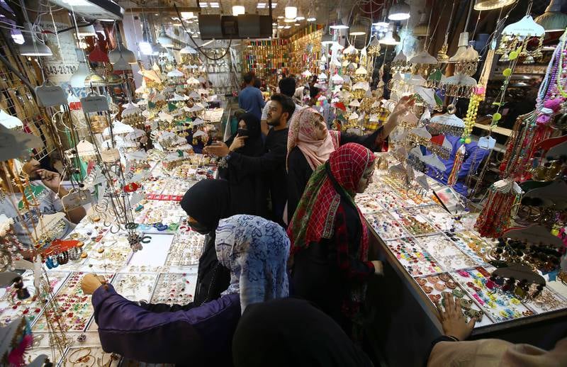Shoppers throng a market in Karachi, Pakistan. EPA