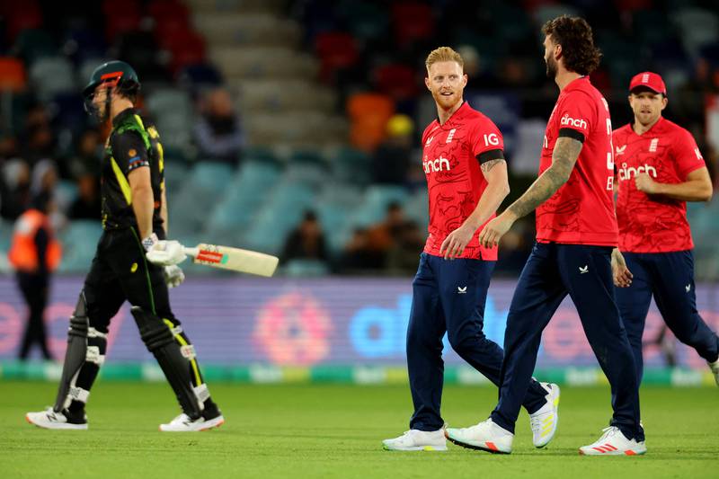 England's Ben Stokes celebrates taking the wicket of Australia's Mitchell Marsh, left, with temmates. AFP