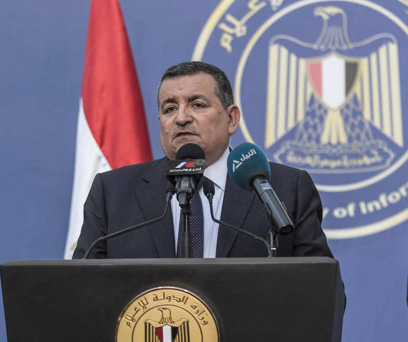 Egyptian State Minister of Media and Information Osama Heikal (C) speaks during a press conference with Minister of Civil Aviation Mohamed Manar (L) and Minister of Tourism and Antiquities Khaled al-Anani in the capital Cairo on June 14, 2020, to announce the country will resume international flights at all Egyptian airports as of 1 July. - Egypt will reopen its airports on July 1 and begin welcoming to beach resorts tourists kept away by the coronavirus pandemic, the government announced Sunday. Flights will resume "between Egypt and countries which have reopened their airspace", said Aviation Minister Mohamed Manar during a press conference in Cairo. (Photo by Khaled DESOUKI / AFP)