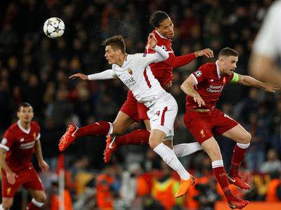 Roma's Patrik Schick in action with Liverpool's Virgil van Dijk and Jordan Henderson. Phil Noble / Reuters