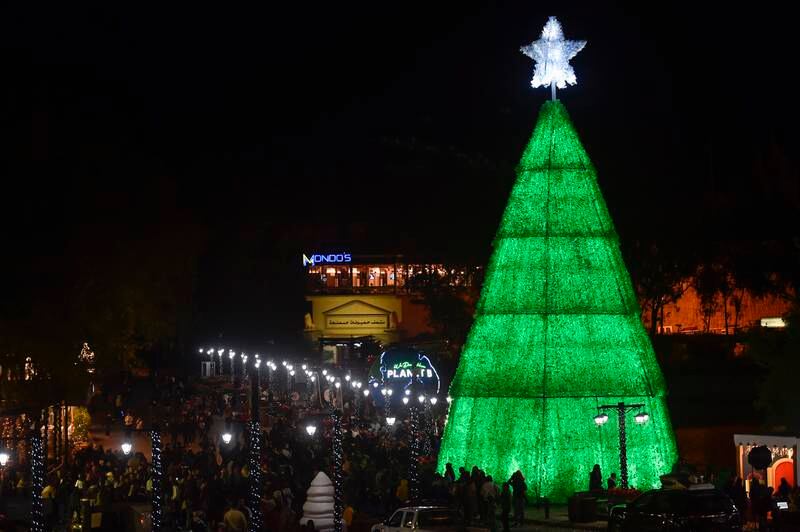 A 18-metre Christmas tree stands at the gateway to Bnachii Lake, Zgharta district, northern Lebanon. It was made using 108,000 discarded plastic bottles. EPA