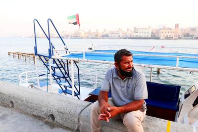 Mohammed Akram waiting for the customers near his boat at the creek in Deira Dubai during the evening on April 21, 2021. Pawan Singh / The National. Story by Sarwat Nasir