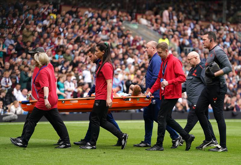 Injured Newcastle midfielder Joelinton is carried off the pitch on a stretcher. PA