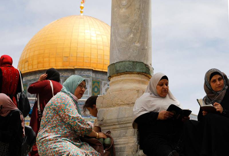 Palestinian women pray outside the Dome of the Rock shrine on the final Friday of the holy month. The core of the shrine is one of the oldest surviving works of Islamic architecture. AFP