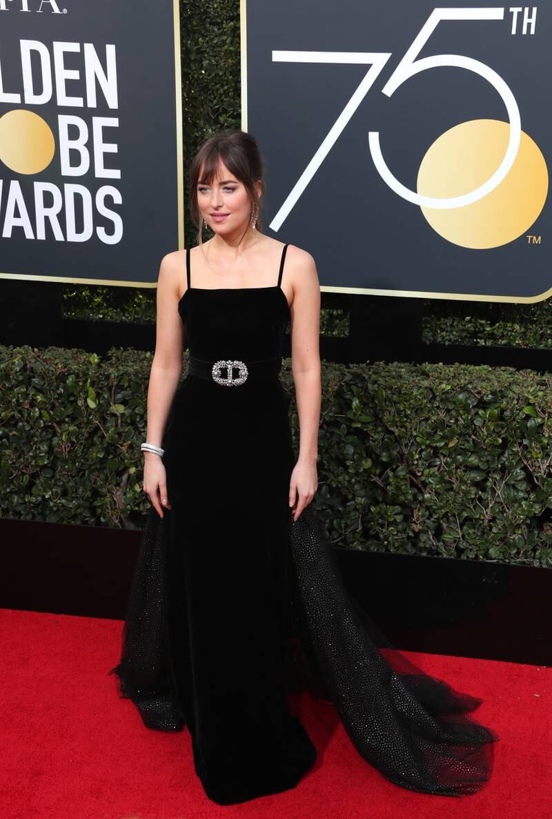 Dakota Johnson, in Gucci, attend the 75th annual Golden Globe Awards at the Beverly Hilton Hotel in Beverly Hills, California, on January 7, 2018. EPA