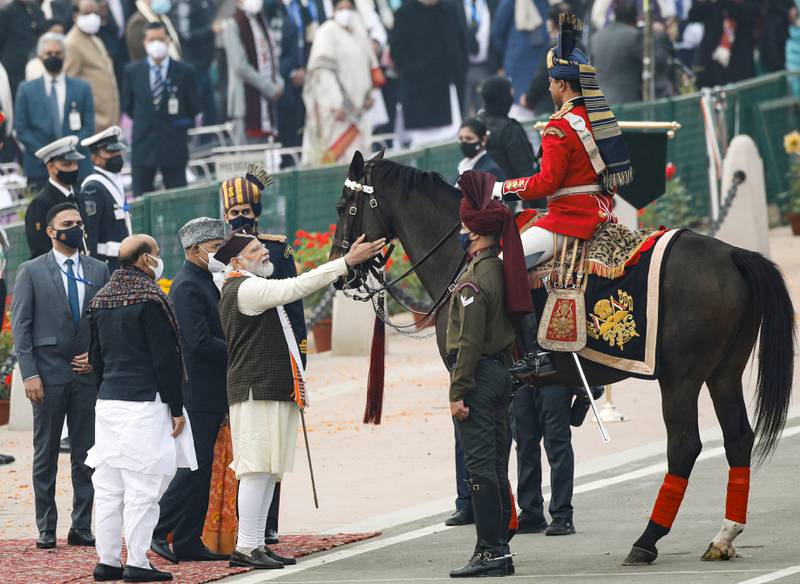 India's Prime Minister Narendra Modi talks to a presidential guard after the Republic Day parade in New Delhi. Reuters