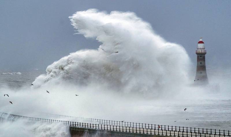 Waves crash against Roker Lighthouse in Sunderland, northern England during Storm Arwen. The storm's 160kph gusts battered parts of the UK at the weekend. Photo: PA