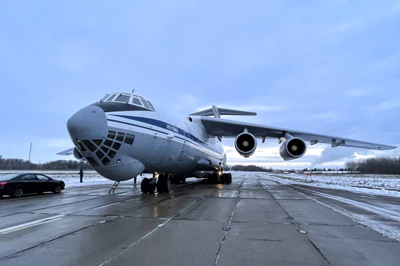 A Russian military plane with Belarusian troops on board waits to take off from an airfield outside Minsk, Belarus, to fly to Kazakhstan. AP