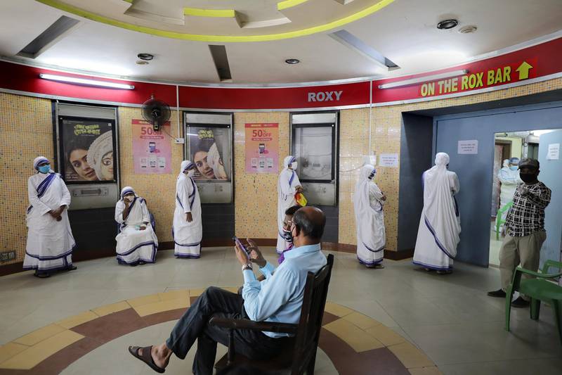 Nuns wait to take a test for Covid-19 at a test center in Kolkata, Eastern India. EPA