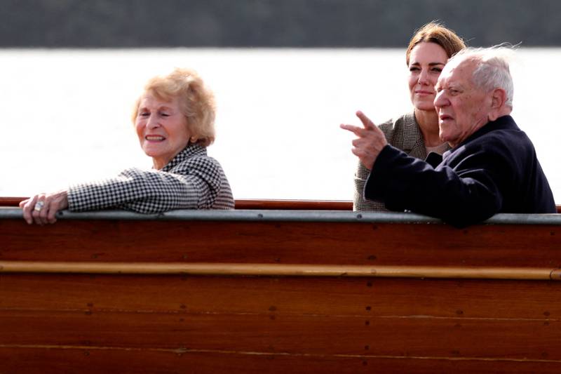 Kate speaks to Windemere Boy Arek Hersh and his partner Jean during the boat trip. AFP
