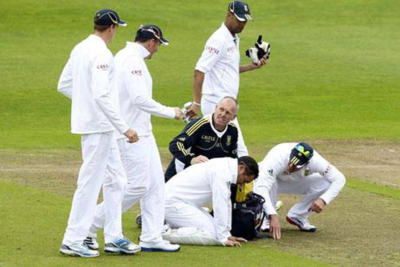 South Africa's Mark Boucher receives on-field treatment after being struck in the eye against Somerset