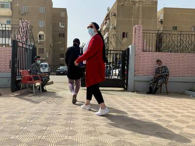 A woman, wearing a protective face mask amid the coronavirus disease outbreak, walks after she received a dose of AstraZeneca's COVID-19 vaccine at a health centre in Qatameya, Cairo, Egypt. Reuters