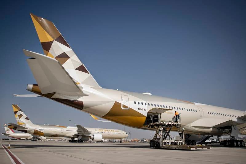 Etihad A350 with a B777 in the background - the average age of Etihad's fleet is 5.7 years. Photo: Etihad