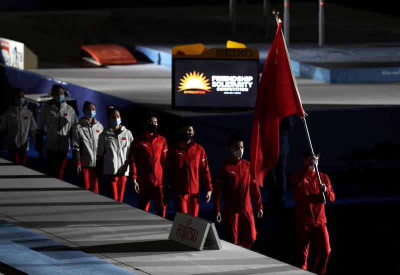 Members of the Chinese team head onto the floor before the competition. AP