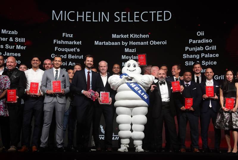 Chefs proudly stand with their awards during the 'Michelin Guide Abu Dhabi' unveiling at Emirates Palace. All photos Pawan Singh / The National 