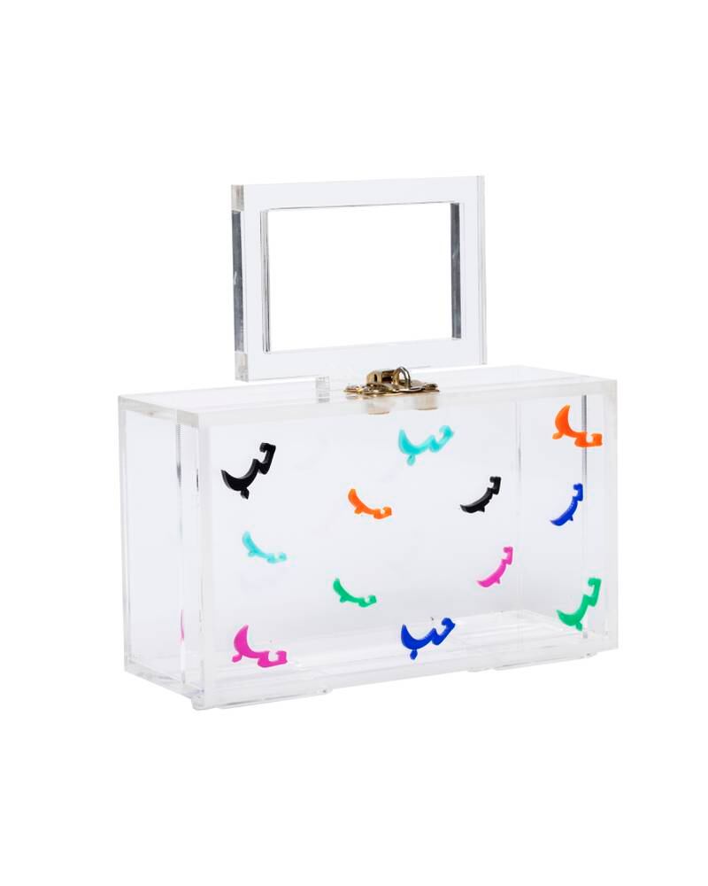 A Plexiglas handbag by Meera Toukan peppered with the word 'Love'