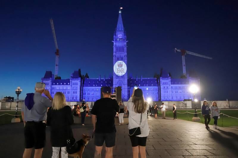 Queen Elizabeth's royal cypher is projected onto the Peace Tower on Parliament Hill in Ottawa, Canada. Reuters
