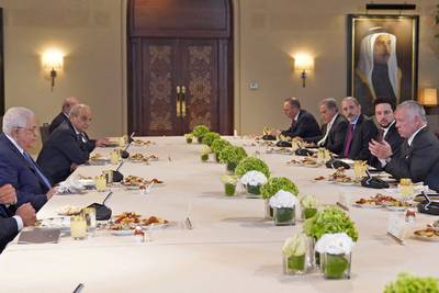 King Abdullah, right, met Palestinian President Mahmoud Abbas in Amman on Sunday. AFP