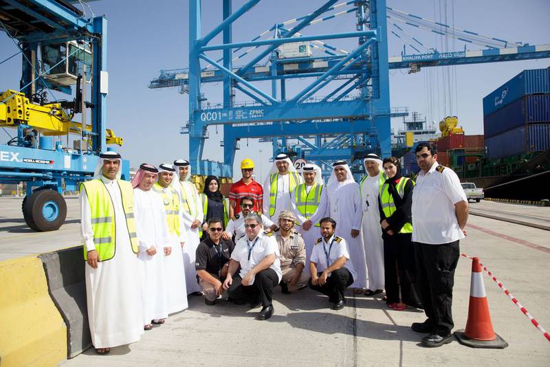 Above, the Emirati operations team at Khalifa Port with Dr Sultan Al Jaber, sixth from right, Minister of State and chairman of Abu Dhabi Ports, and Mohamed Al Shamisi, fifth from right, the chief executive of Abu Dhabi Ports. Courtesy Abu Dhabi Ports