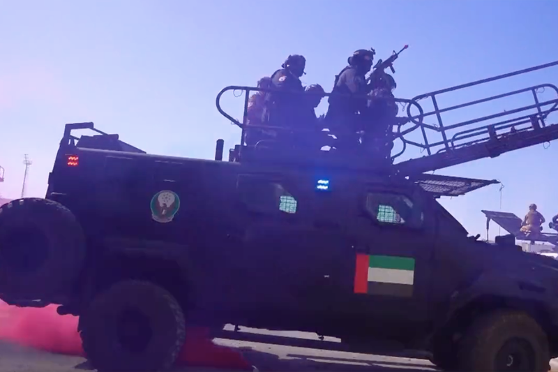Swat teams use ladders mounted on vehicles in a simulated raid. Photo: Ministry of Interior
