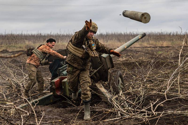 A Ukrainian artilleryman discards an empty shell on the outskirts of Bakhmut, eastern Ukraine, in December 2022. AFP