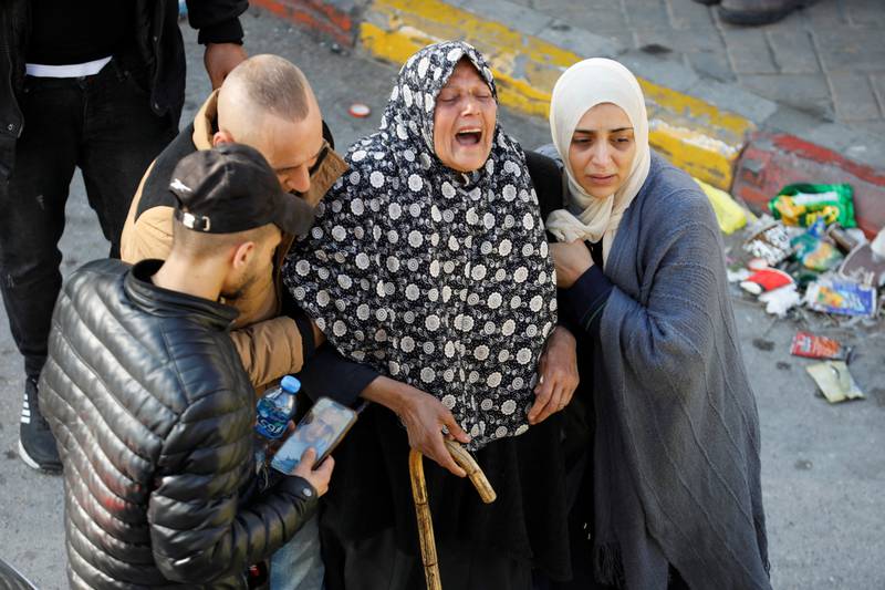 Grief at a  funeral of 10 Palestinians, including gunmen, in Nablus. Reuters