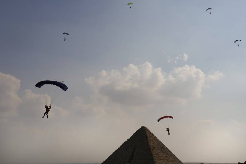 Parachutists in the skies over Giza. AP
