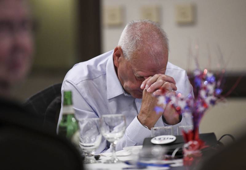 Paul Riley, father of Josh Riley, bows his head as election results come in at his son's election party in Binghamton, New York. Josh Riley, the Democratic candidate, ran against Republican Marc Molinaro.  AP