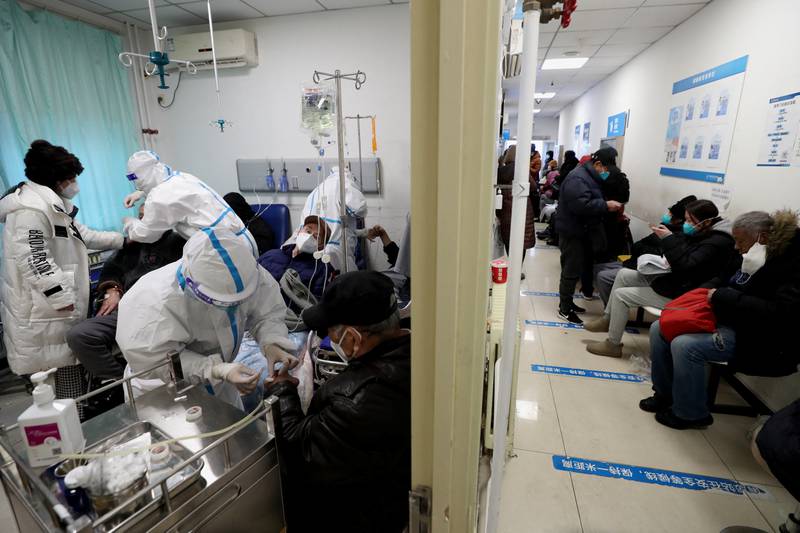 Chinese medical workers treat patients at the fever clinic of China-Japan Friendship hospital, amid the Covid-19 outbreak in Beijing. Reuters