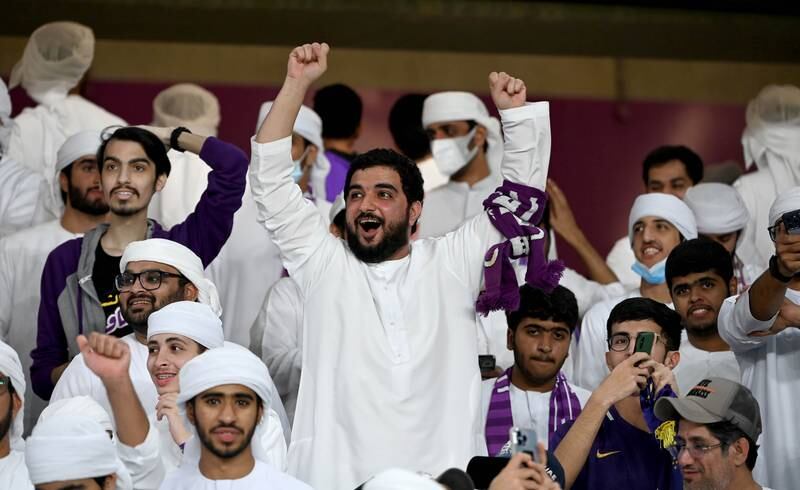 Al Ain supporters celebrate.