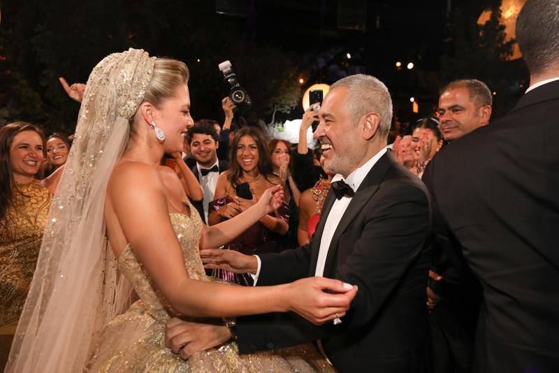 Elie Saab greets his new daughter-in-law at the after party. Photo: ParAzarProductions