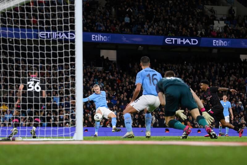 Erling Haaland scores Manchester City's third goal, and his hat-trick. Getty