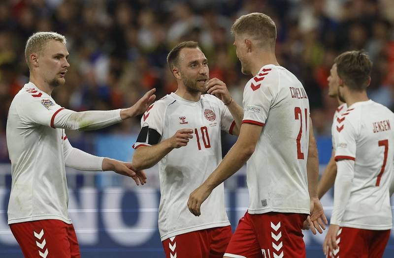 Christian Eriksen, centre, has returned to the Denmark team after his cardiac arrest last summer and remains as important to the team as ever. Reuters