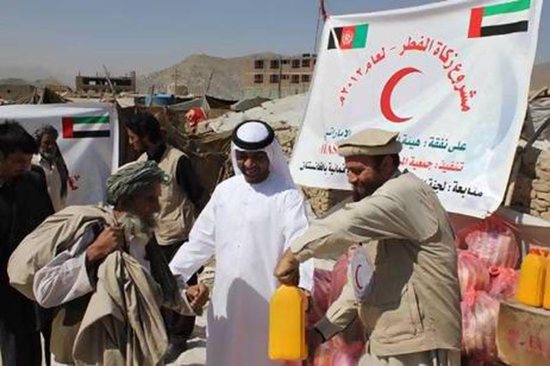 The UAE Red Crescent giving out Zakat Al Fitr [charity given to the needy at the end of Ramadan] in Afghanistan in August 2012. Courtesy Wam