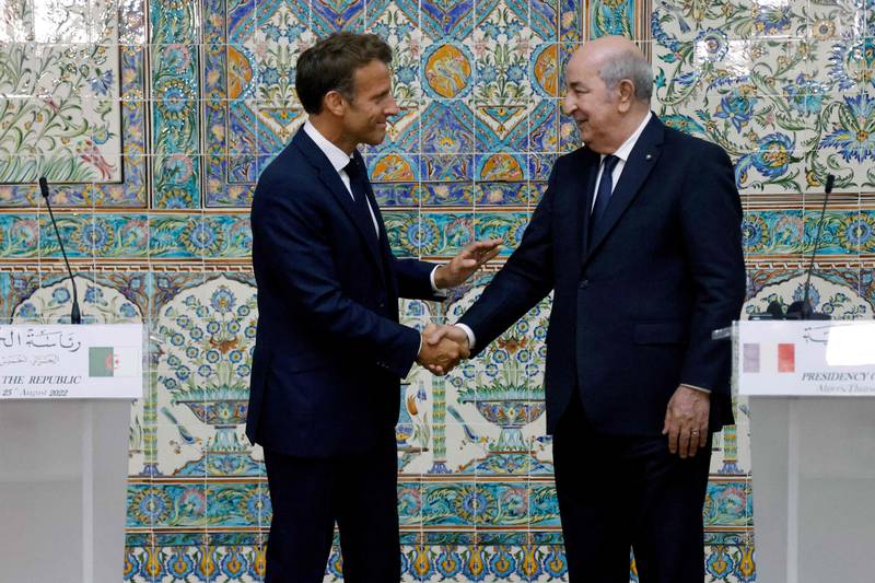 Mr Macron with Algeria's President Abdelmadjid Tebboune at the presidential palace. AFP