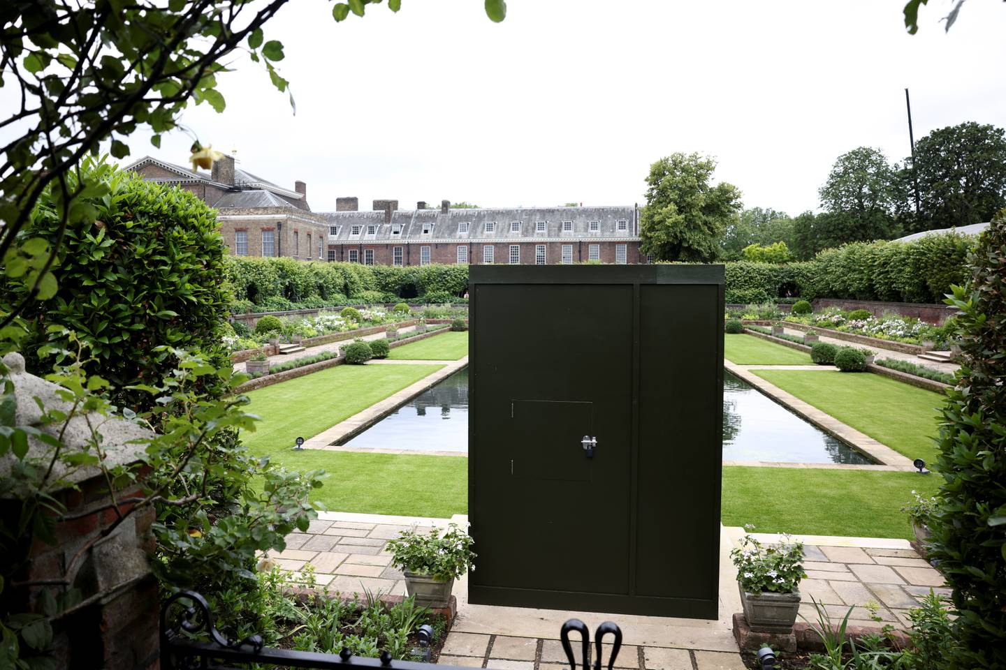 A box covering the statue in place at the Sunken Garden in Kensington Palace ahead of its unveiling on Thursday. Reuters 
