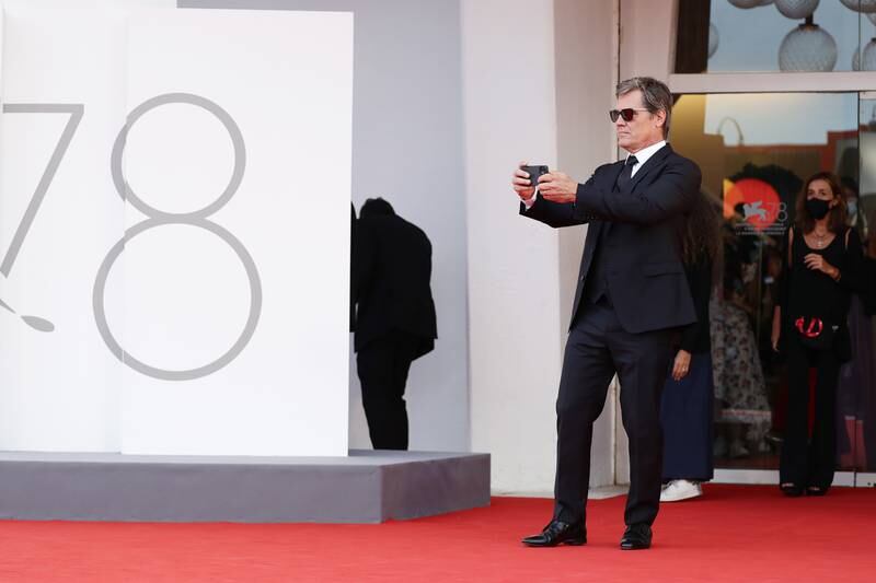 Josh Brolin takes a picture as he attends the red carpet of 'Dune' during the 78th Venice International Film Festival. Getty Images