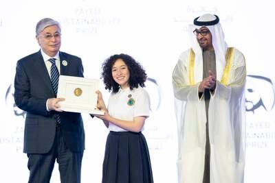 Kassym-Jomart Tokayev, President of Kazakhstan (L), and President Sheikh Mohamed present the 2023 Zayed Sustainability Prize for Americas Global High Schools, to a representative from Fundacion Bios Terrae in Colombia. Photo: Presidential Court