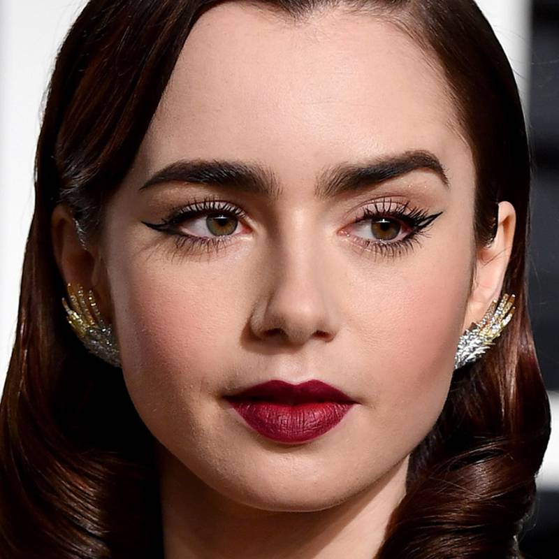 Smoky Eye: Lily Collins with a cat's eye flick, using just two lines of eyeliner. Getty Images