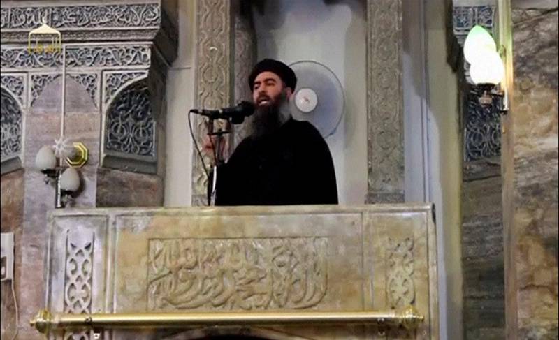 FILE PHOTO: A man purported to be the reclusive leader of the militant Islamic State Abu Bakr al-Baghdadi making what would have been his first public appearance, at a mosque in the centre of Iraq's second city, Mosul, according to a video recording posted on the Internet on July 5, 2014, in this still image taken from video. REUTERS/Social Media Website via Reuters TV/File Photo ATTENTION EDITORS - THIS IMAGE HAS BEEN SUPPLIED BY A THIRD PARTY. REUTERS IS UNABLE TO INDEPENDENTLY VERIFY THE CONTENT OF THIS VIDEO, WHICH HAS BEEN OBTAINED FROM A SOCIAL MEDIA WEBSITE     TPX IMAGES OF THE DAY
