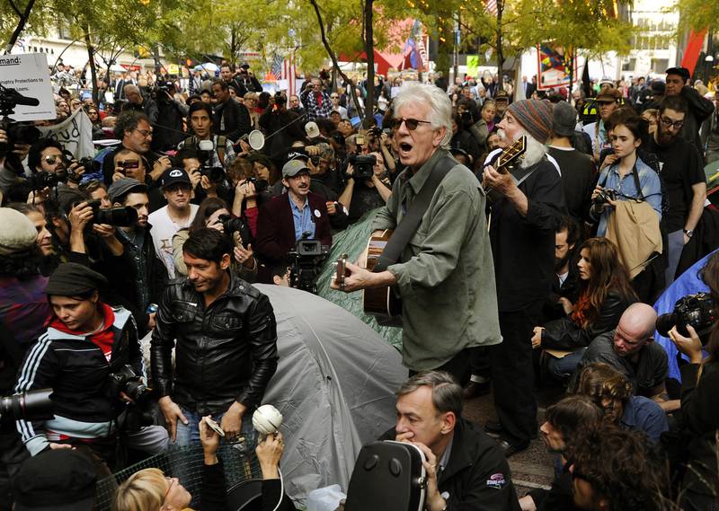 Nash and Crosby perform for demonstrators at an Occupy Wall Street protest. AFP