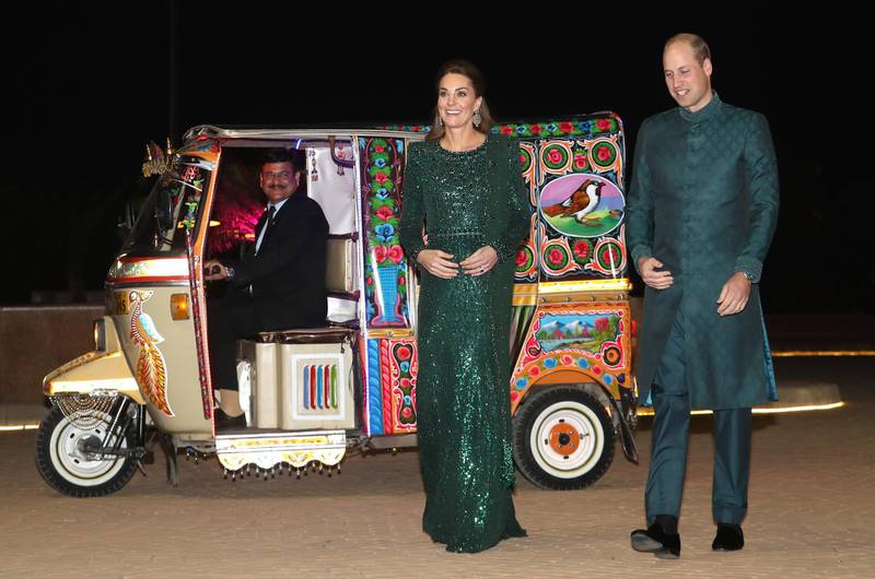 epa07922807 Britain's Catherine, Duchess of Cambridge (C) arrives by Tuk Tuk with her husband Prince William, Duke of Cambridge (R), to attend a special reception hosted by the British High Commissioner at the Pakistan National Monument in Islamabad, Pakistan, 15 October 2019. The royal couple is on an official five-day visit to Pakistan. It is the first royal visit to the country in 13 years.  EPA/CHRIS JACKSON / POOL