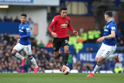LIVERPOOL, ENGLAND - MARCH 01: Mason Greenwood of Manchester United in action with Michael Keane of Everton during the Premier League match between Everton FC and Manchester United at Goodison Park on March 01, 2020 in Liverpool, United Kingdom. (Photo by Matthew Peters/Manchester United via Getty Images)