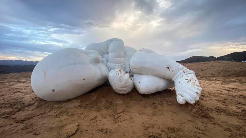 In late 2021, a marble sculpture of a child in fetal position showed up in the Fujairah desert. It is by Italian artist Jago, who first installed the work in Naples in 2020. All photos: Antonie Robertson / The National