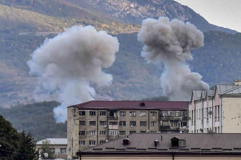 Smoke rises after shelling in Stepanakert, during fighting between Armenia and Azerbaijan over the disputed region of Nagorno-Karabakh on October 9, 2020.  AFP