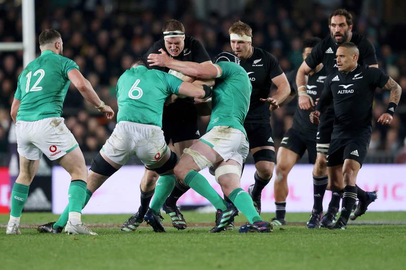 Brodie Retallick of New Zealand is tackled by Ireland players. AFP